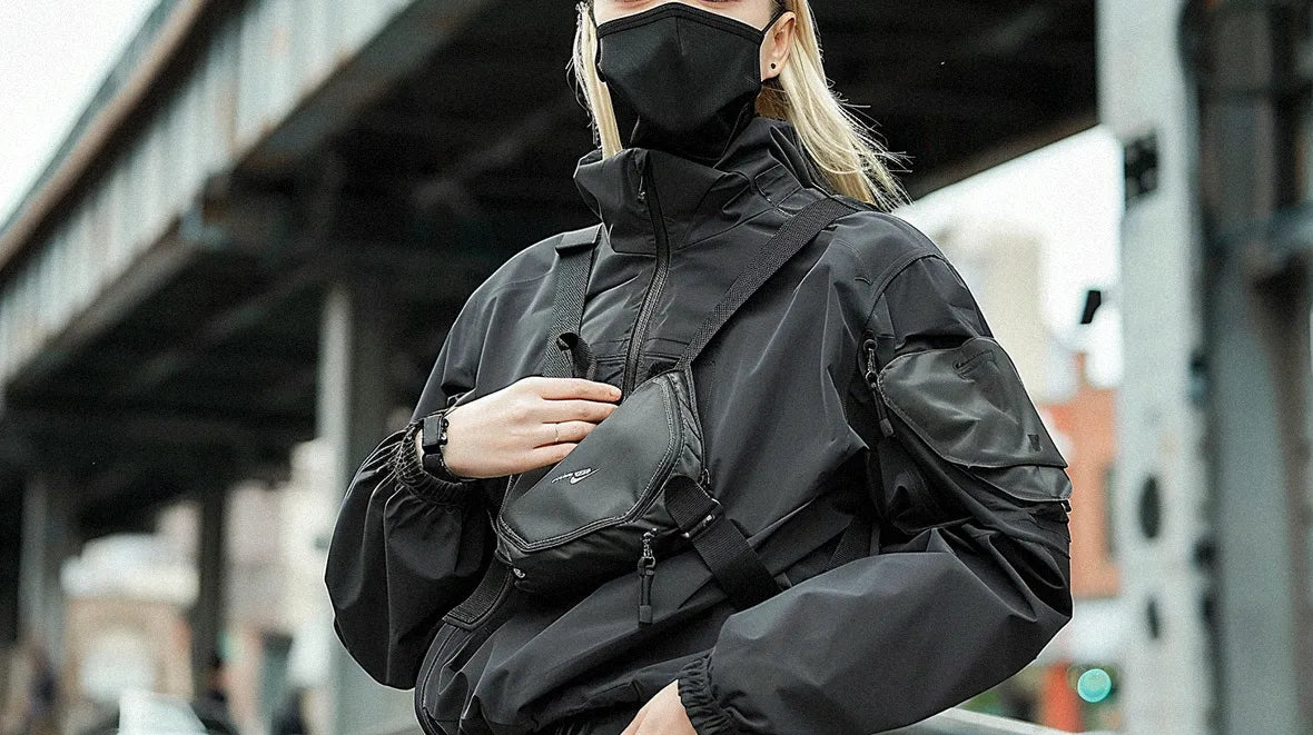 a blonde girl wearing a techwear fanny pack