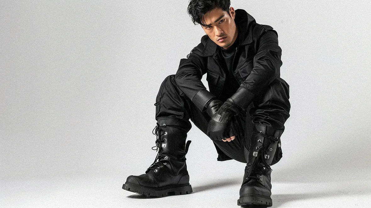 an asian man in black techwear outfit