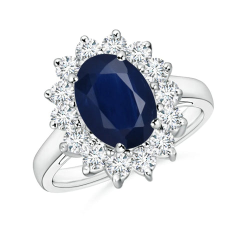 Kate Middleton, Princess of Wales, Duchess of Cambridge engagement ring made from a blue ceylon sapphire and diamond cluster halo. Kate Middleton's engagement ring was Princess Diana's former engagement ring, given to Kate Middleton on her engagement from Prince William. Buckingham Palace Gift Shop