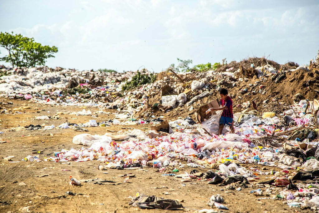 child on landfill in nature