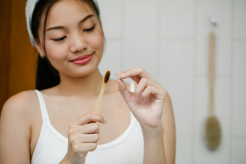 woman using toothpaste tablets