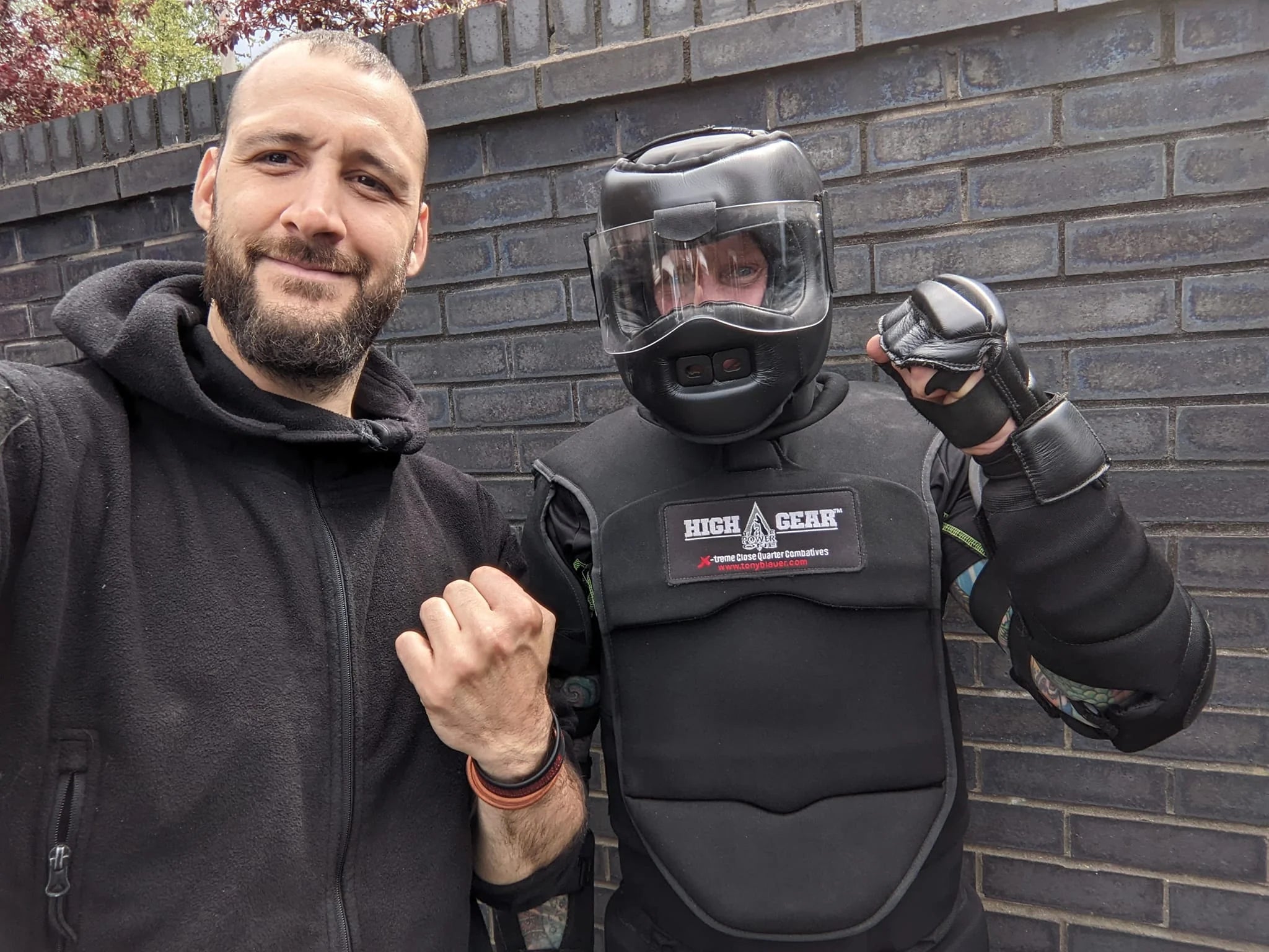 Julien Masson and his training partner wearing a high gear suit