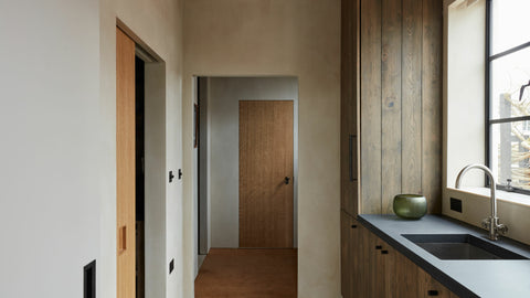 Bespoke kitchen joinery and wood clad wall