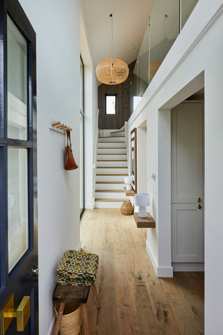 Reclaimed wood flooring used in the hallway of a modern home