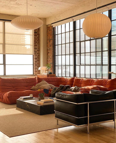 orange togo sofa in a modern livingroom