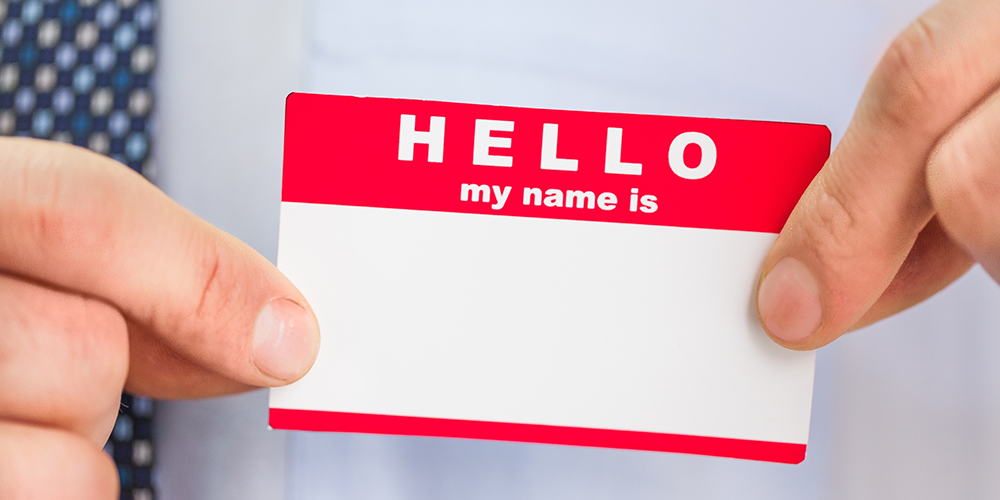 Person Holding a name tag sticker