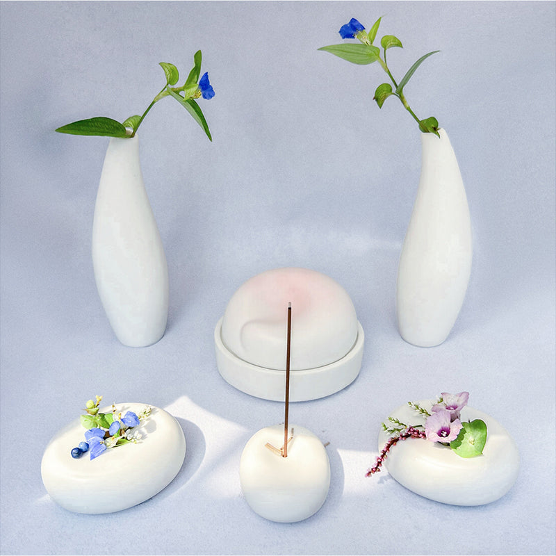 This image features the Dreaming Pet Memorial Set, which includes a stone bowl for keepsakes, a ceramic incense holder, and a delicate water drop vase. The set is designed to honor and remember pets who have passed away, offering a peaceful and serene memorial alternative.