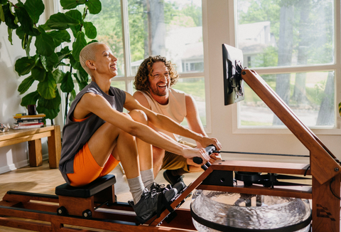 One Ergatta member encouraging another while they row.