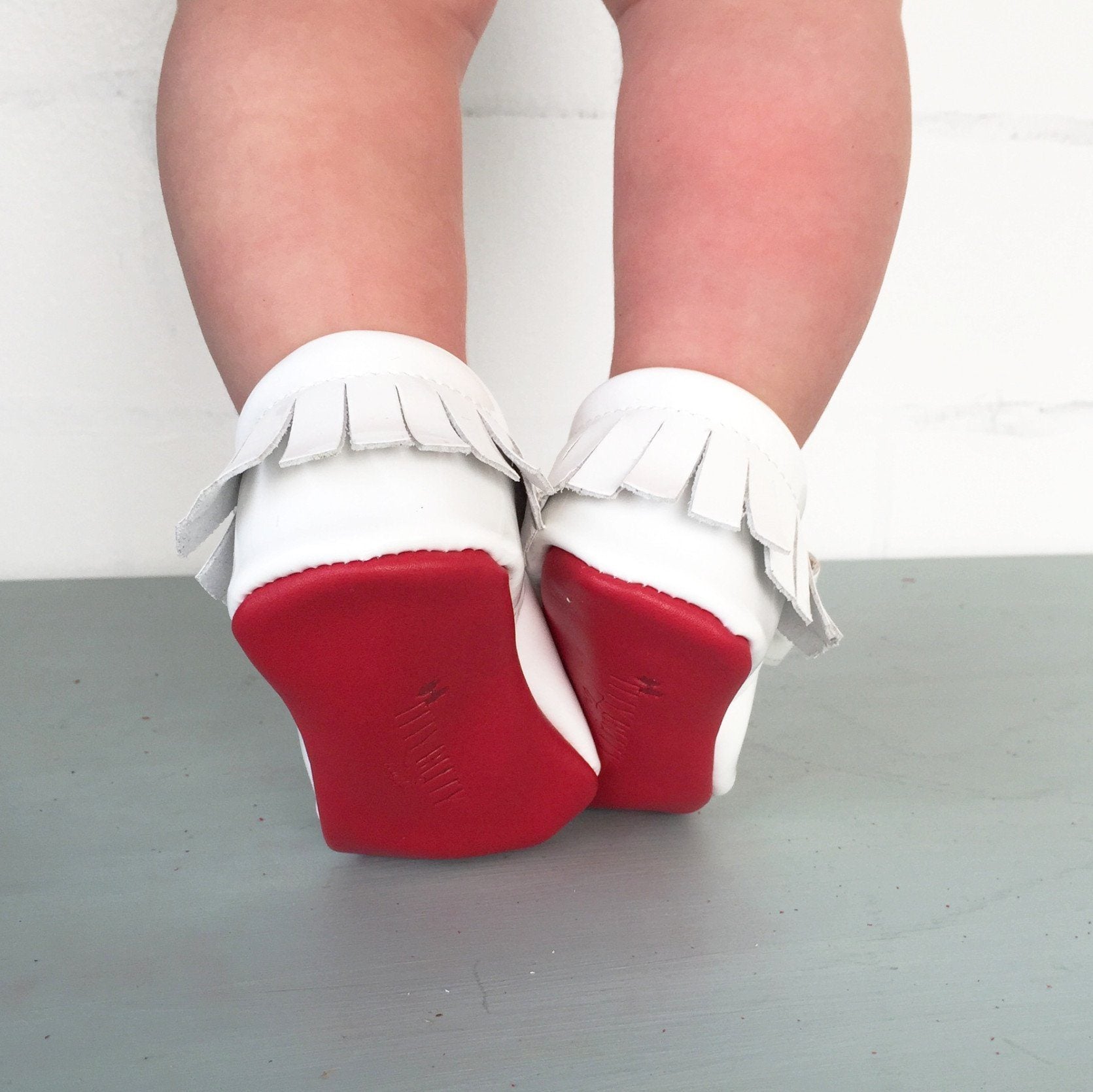 red bottom baby moccasins