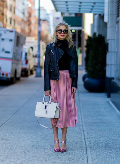 Pink pleated skirt with matching heels and edgy leather jacket