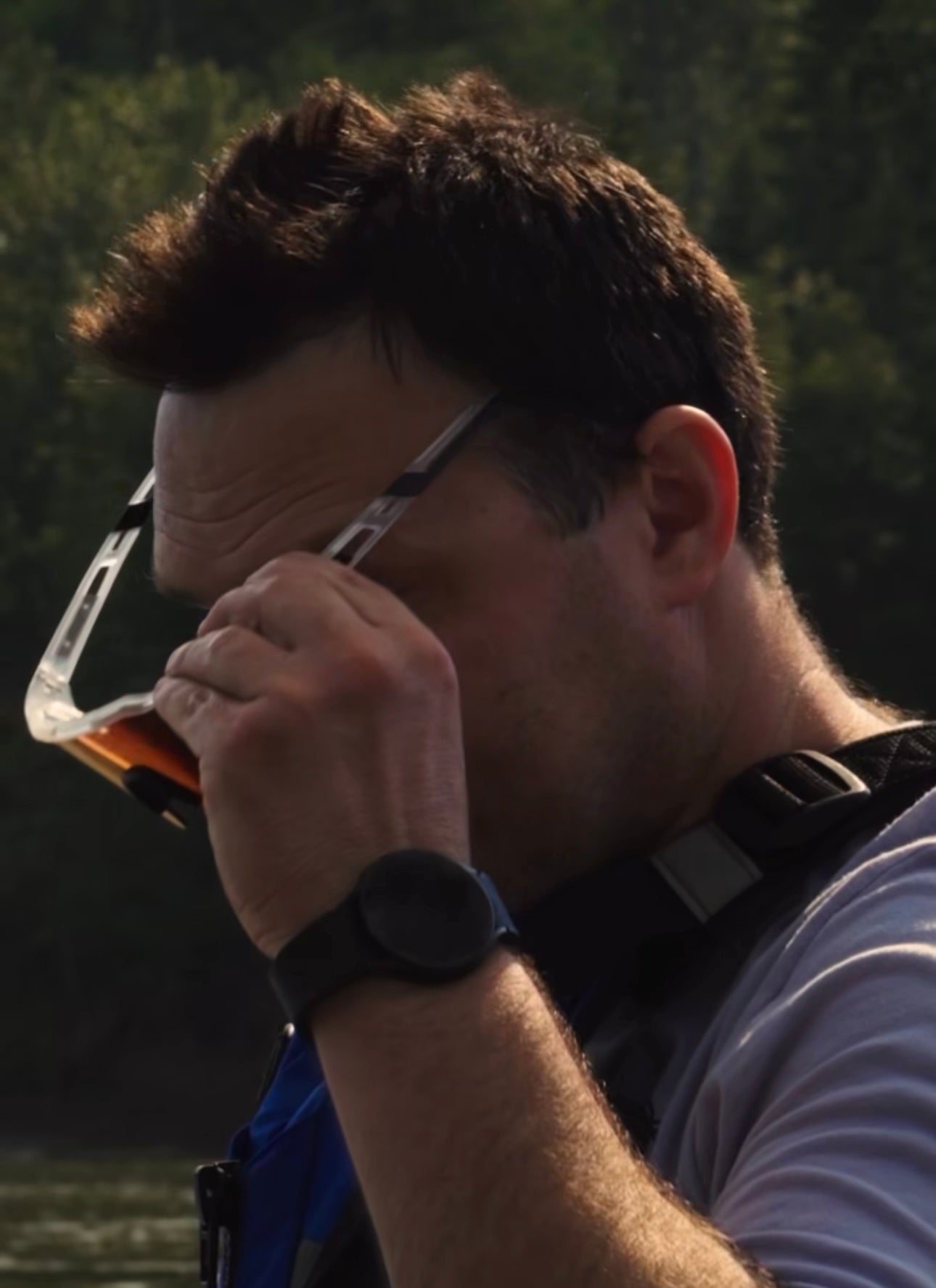 a male putting on The Jenna sunglasses