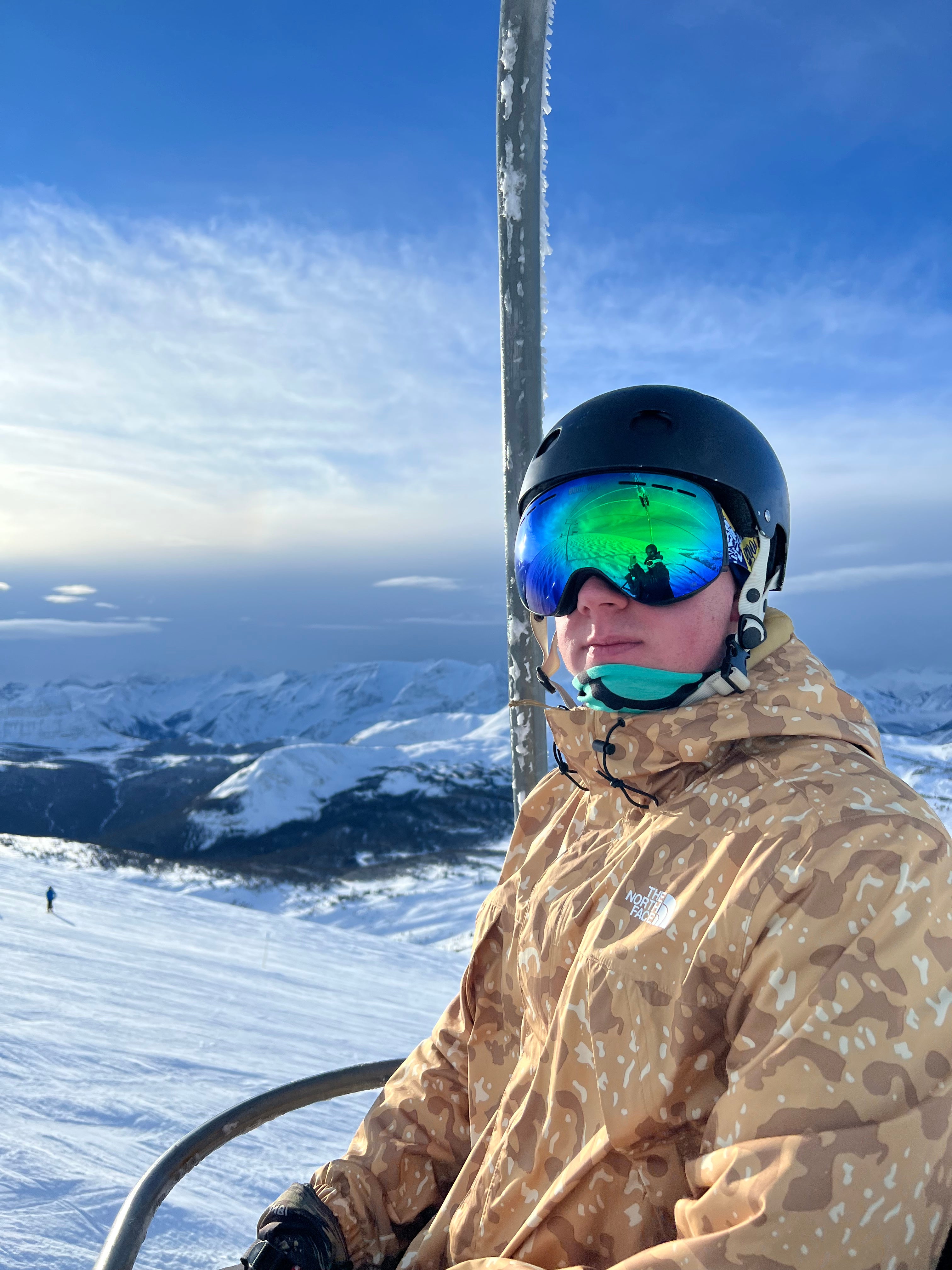 photo of skier on chair lift