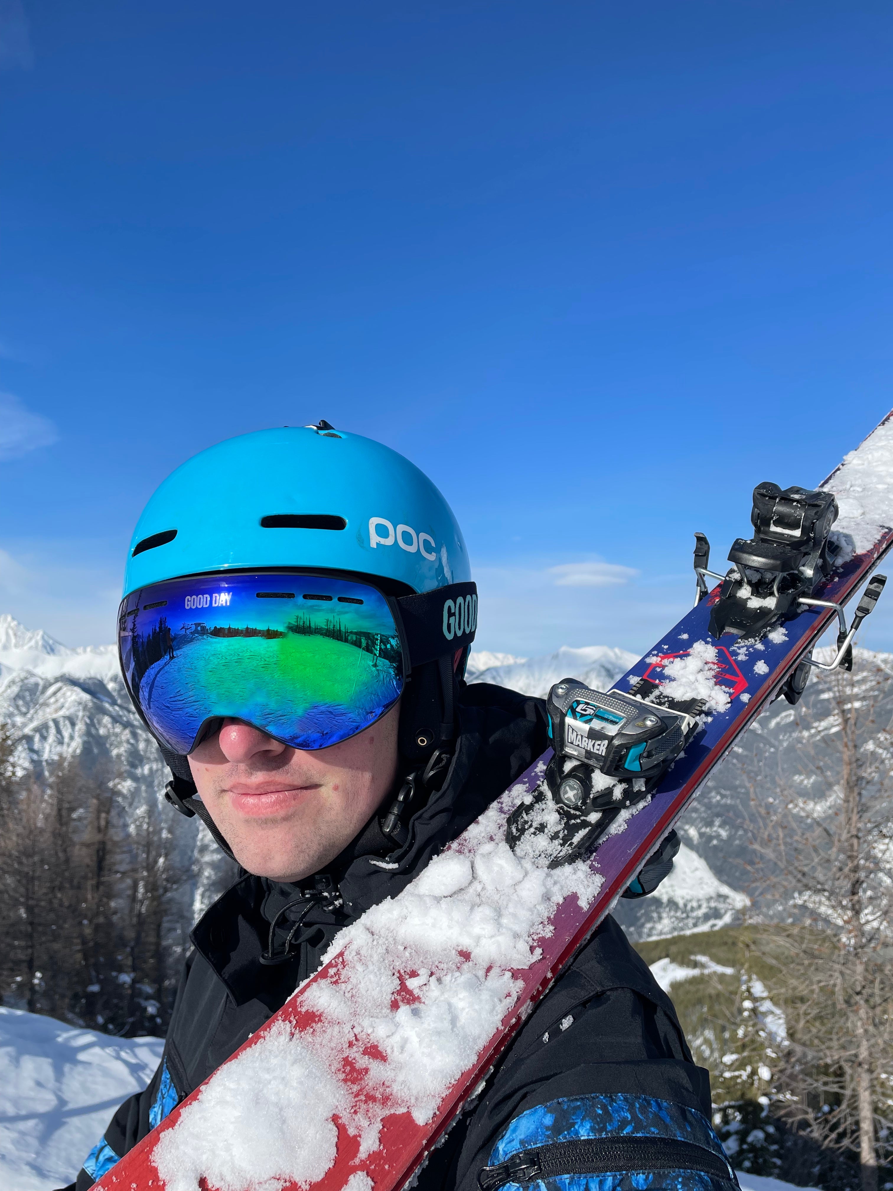 photo of Jared with skis and a helmet