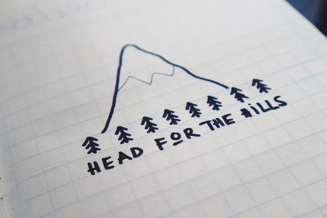 Head for the hills written on paper