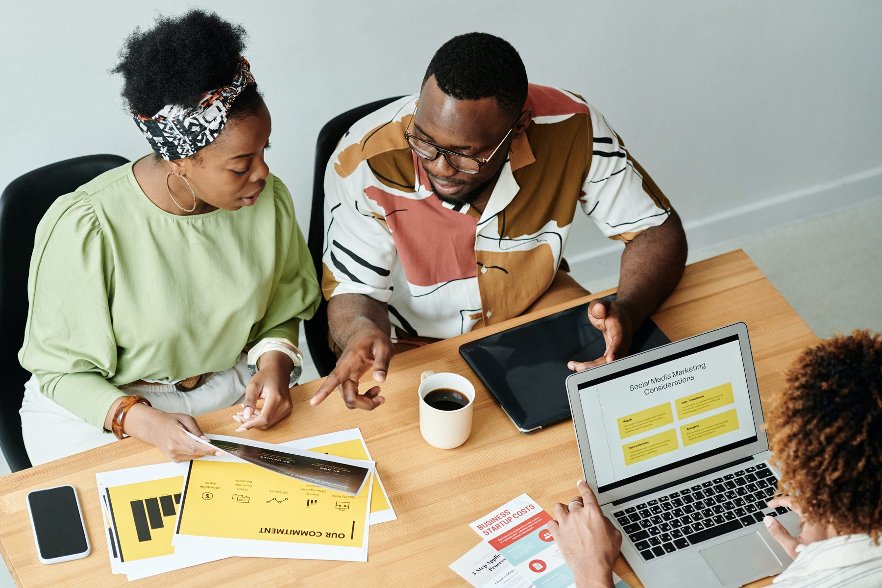 How To Build Your Own Brand in 7 Easy Steps - African American couple working at table