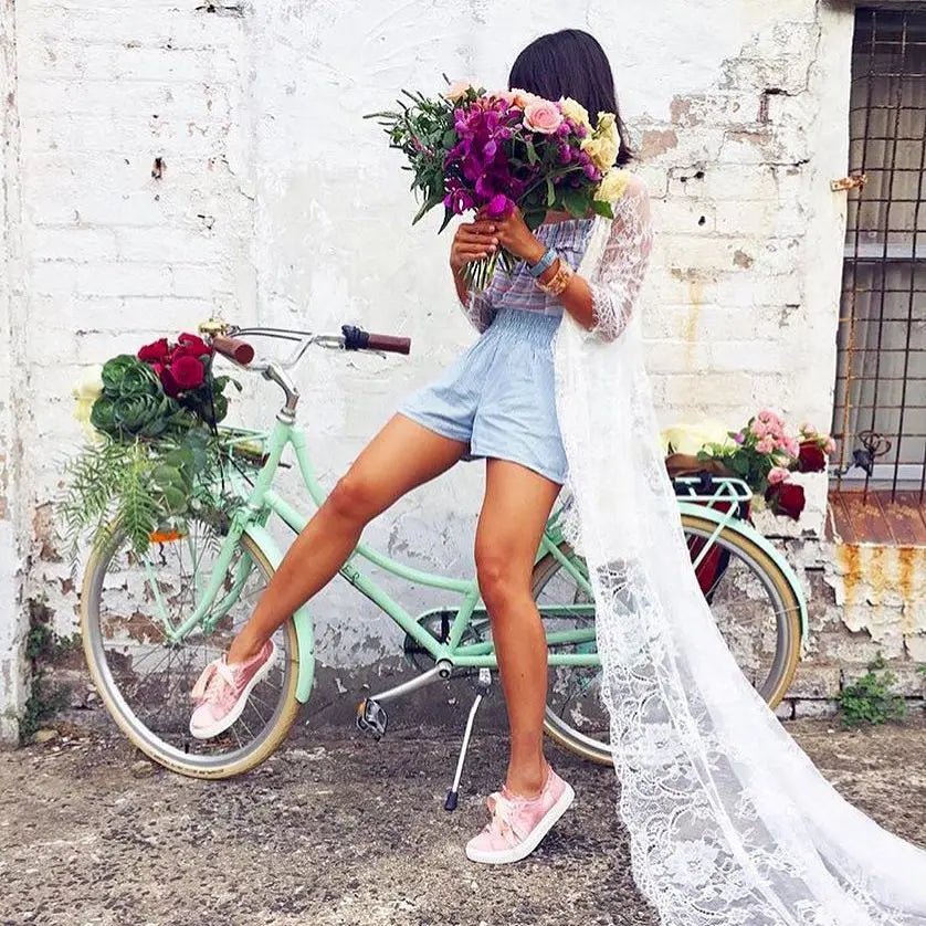 bicycle and woman with flowers