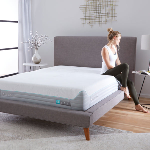 Woman Sitting On Corner Of Bedgear S5 II Performance Mattress