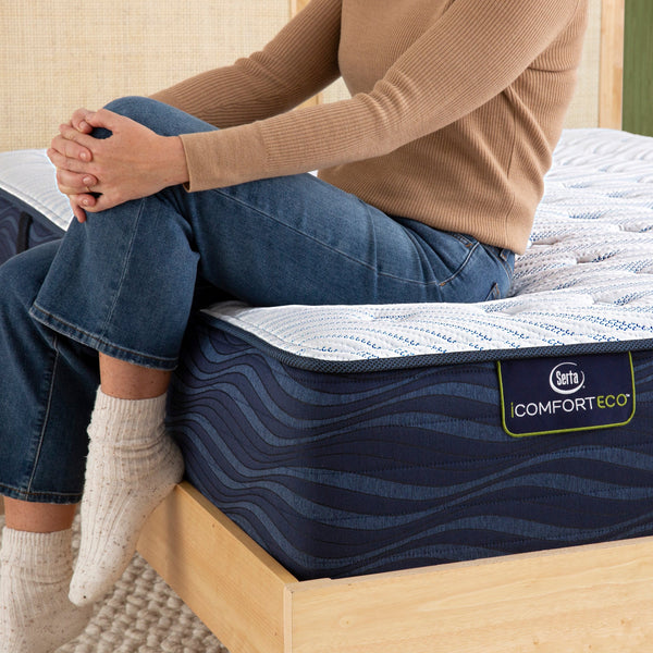 Sitting On Serta iComfortECO Quilted Hybrid Extra Firm Mattress