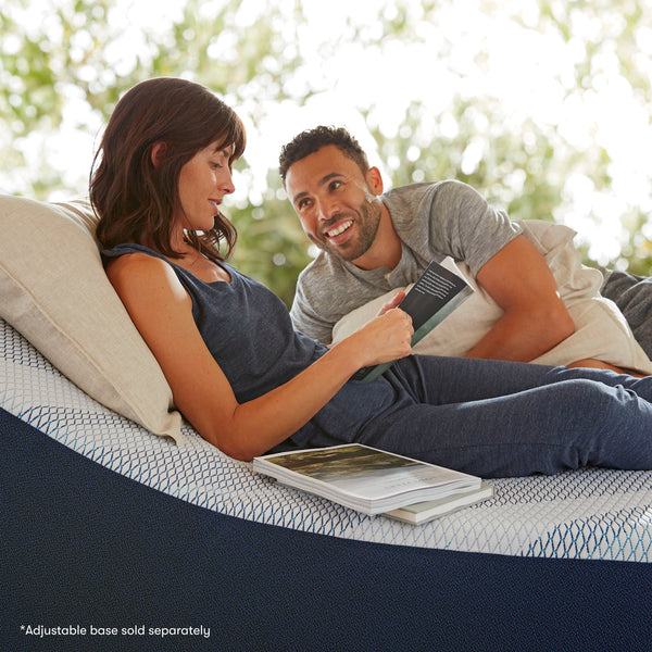 Couple Laying On Serta iComfortECO Foam Firm Mattress