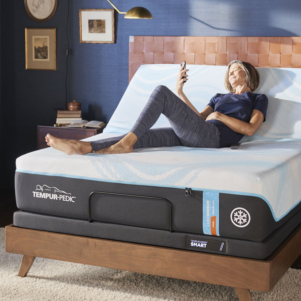 Woman laying on mattress on a Tempur-Pedic Ergo Smart 3.0 Adjustable Base