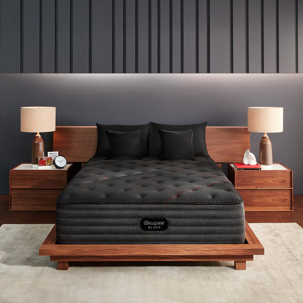 Beautyrest Black C-Class Firm Mattress On Bed Frame With Pillows In Bedroom Front View