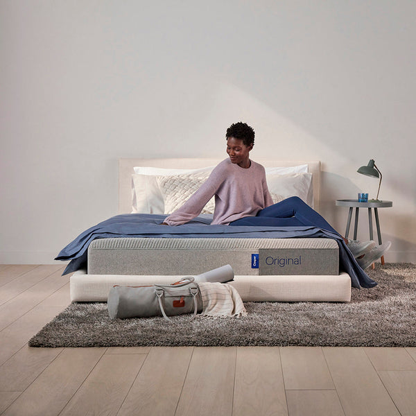 Woman Relaxing On Casper Original Foam Mattress On Bed In Bedroom