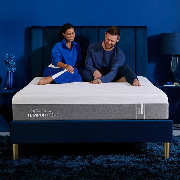 Couple Sitting On Tempur-Cloud Medium Hybrid Mattress