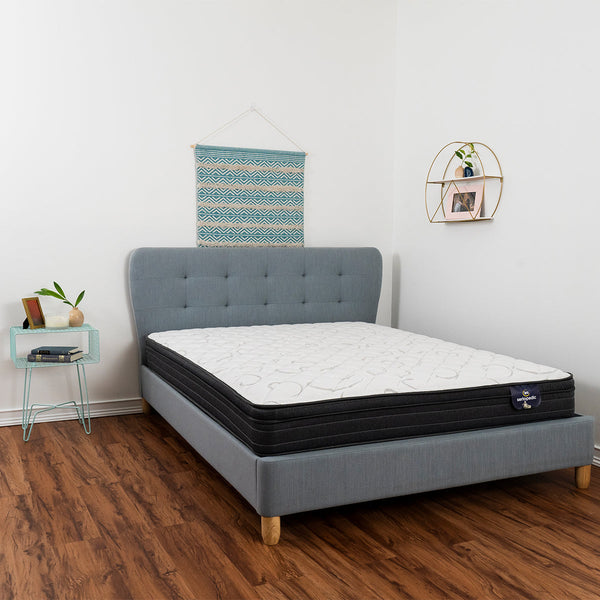 Sertapedic® Elkridge Euro Top Mattress by Serta On Bed Frame In Bedroom Side View.