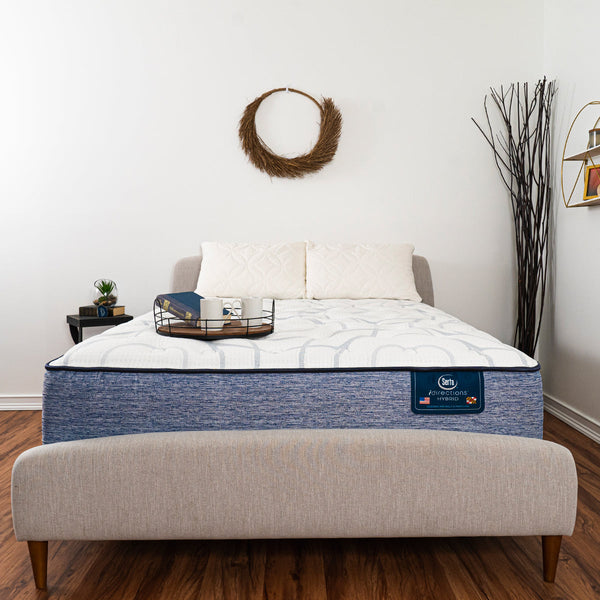 Serta iDirections X6 Hybrid II Firm Mattress On Bed Frame In Bedroom With Serving Tray Holding Coffee Mugs and Book