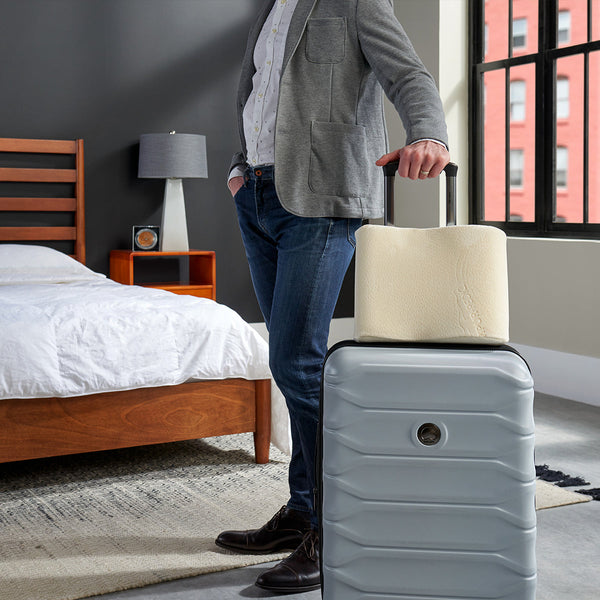 Man Traveling With Tempur-Pedic Neck Pillow