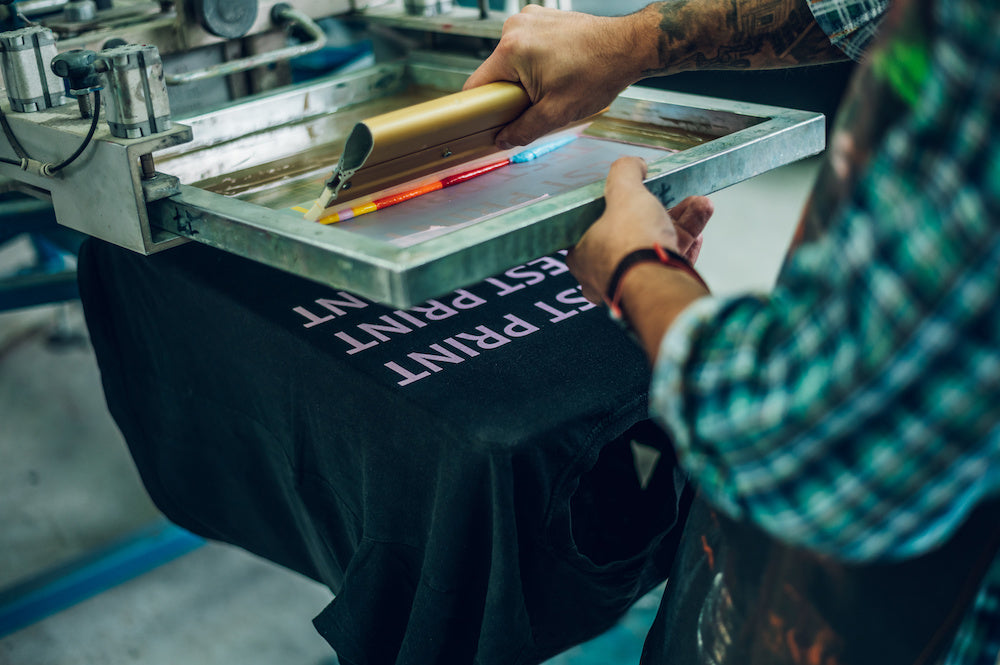 man doing screen printing