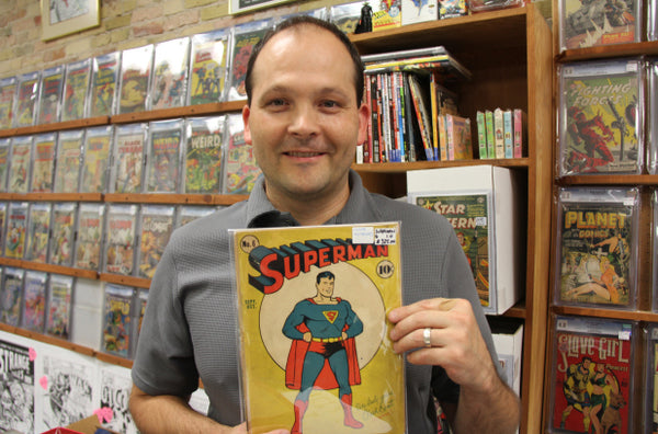 Forest City Collectibles - Andrew Greenham holding Superman #1