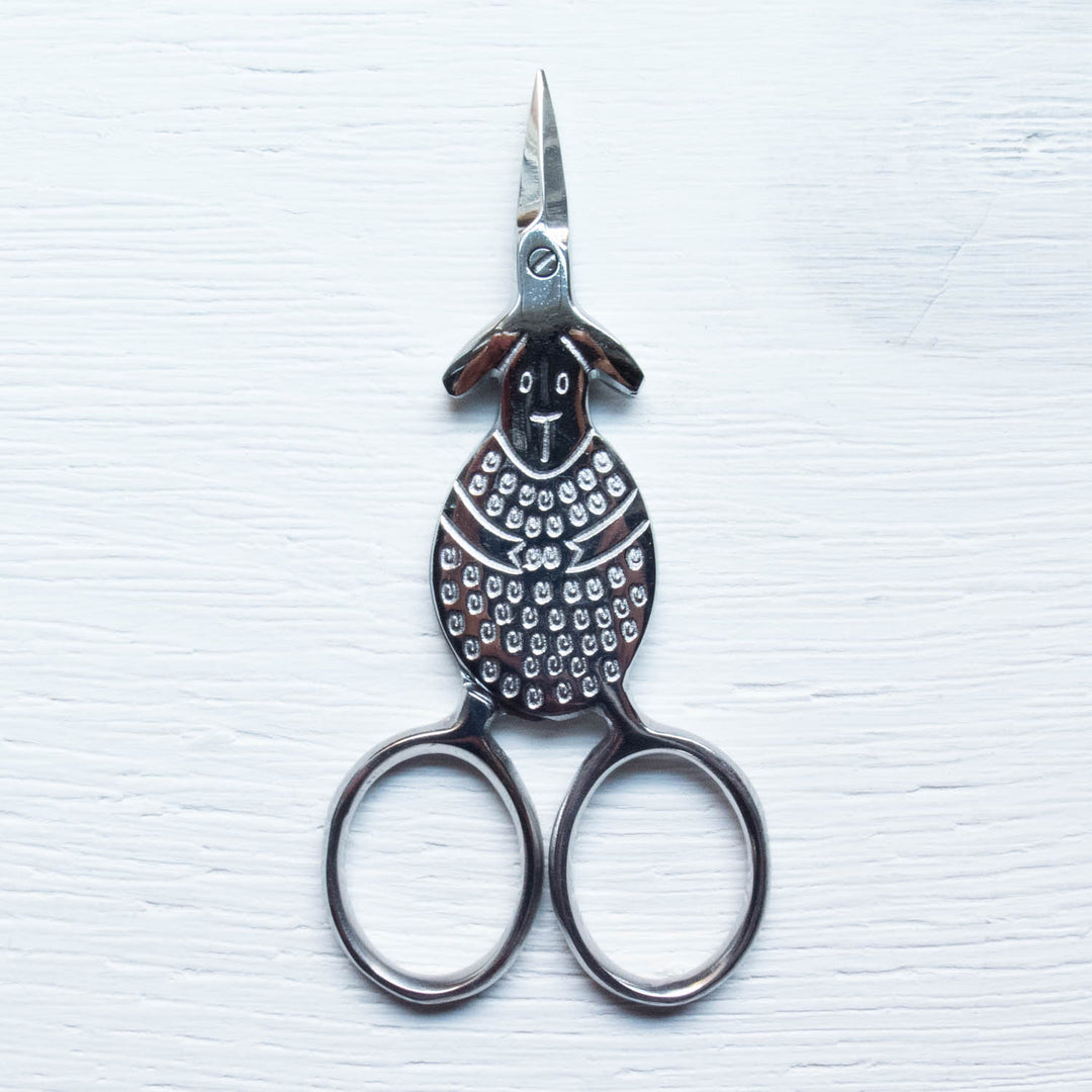 https://cdn.shopify.com/s/files/1/0658/3323/products/SilverSheepScissors-1.jpg?v=1579687981&width=1080