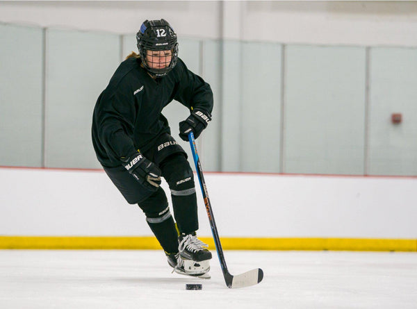 hockey player with a helmet with chin strap