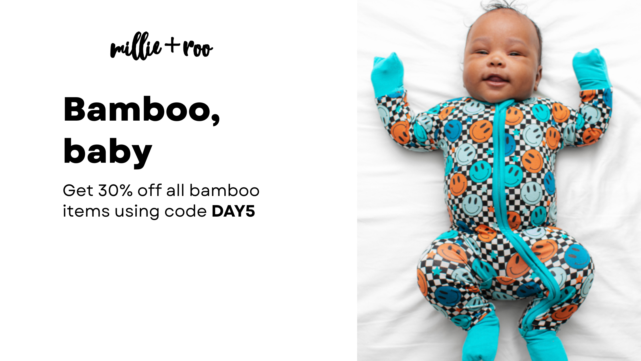 A little boy lays on a bed wearing a bamboo sleep romper. The romper is blue and features check marks and smilie faces