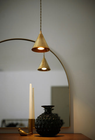 unlacquered minimalist brass pendant light