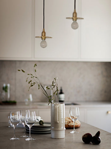 minimalist brass pendant light in the kitchen