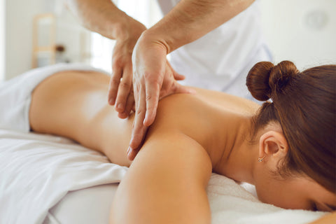 woman receiving massage from professional masseur