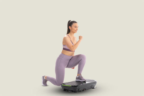 woman doing lunges on vibration plate