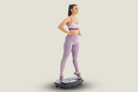 woman standing on her toes on vibration plate