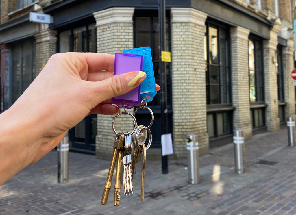 Woman holding keys to Tala's new showroom in Shoreditch