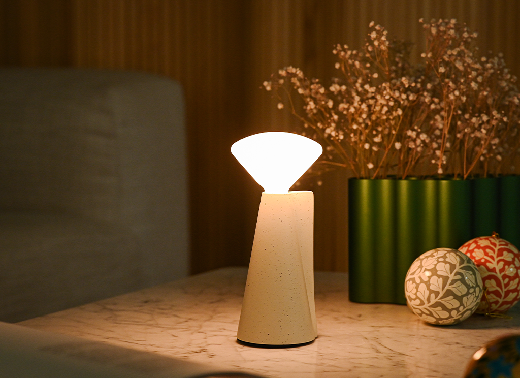 Mantle table lamp on a side table with Christmas ball balls