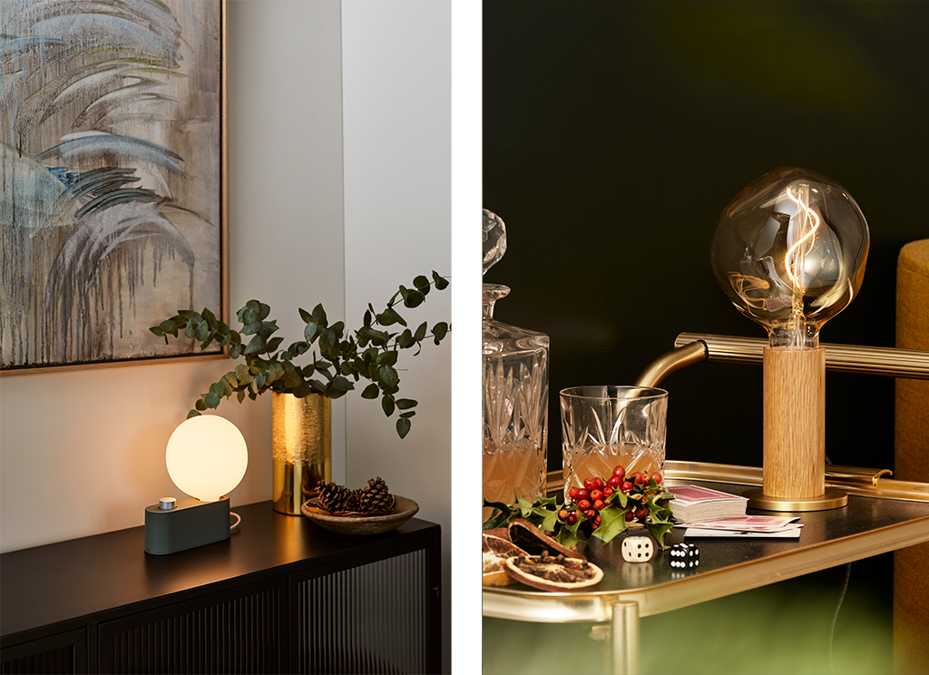 Two images in one, the first image has a sideboard that has the Alumina Table Lamp and a brass vase situated on top, the second image shows the Knuckle Table Lamp on an alcohol cart that has Christmas decorations