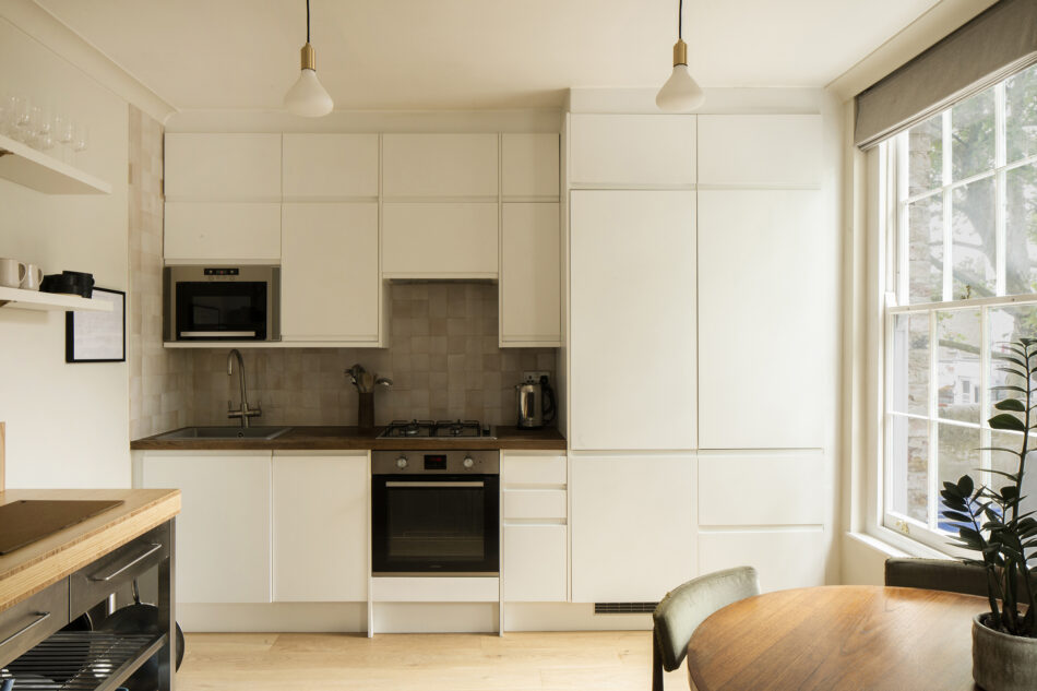 Open plan Kitchen featuring the Noma and brass pendant