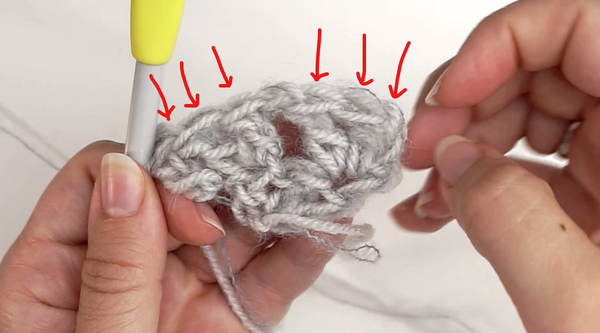 Double crochet and chains in yarn to create a Mesh-pattern