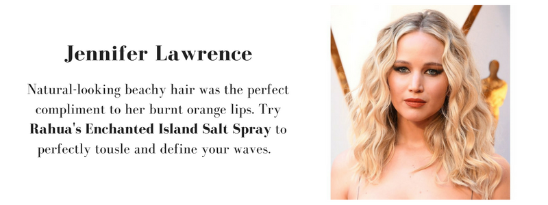 jennifer lawrence wearing natural-looking beachy hair and burnt orange lips. to recreate her look, use rahua's enchanted island salt spray