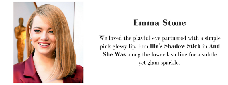 emma stone wearing a playful eye look and a pink glossy lip. to recreate her look, use ilia's shadow stick in and she was. 