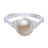 14k white gold classic pearl and diamond cluster ring.