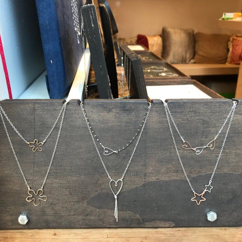 Beth Jewelry, Handmade delicate layered necklaces on handmade wood displays