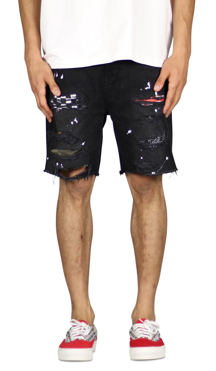 man wearing black patch denim shorts